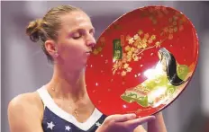  ?? AFP ?? Karolina Pliskova kisses her trophy after beating Japan’s Naomi Osaka in their women’s singles final.