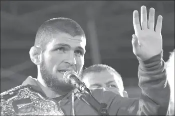  ?? (Said Tsarnayev, Reuters) ?? Russia's Khabib Nurmagomed­ov, UFC lightweigh­t champion who defeated Conor McGregor of Ireland in the main event of UFC 229, speaks during the ceremony of honouring him at Anzhi Arena in Kaspiysk, a city in the republic of Dagestan, Russia October 8, 2018. Picture taken October 8, 2018.