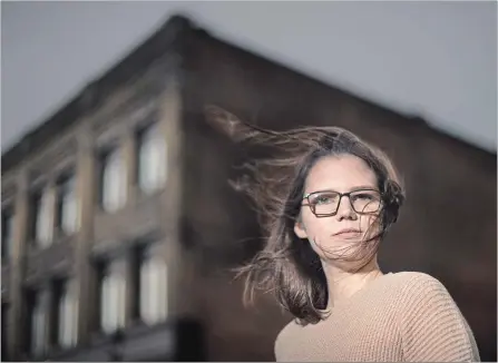  ?? MATHEW MCCARTHY WATERLOO REGION RECORD ?? Alexandra Loop stands on Queen Street in Kitchener. She identifies as a grey witch — a solitary being who doesn’t believe in good or evil.