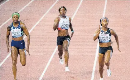 ?? AP ?? Shelly-Ann Fraser-Pryce (right) of Jamaica wins the women’s 100 metres in a personal best and meet record 10.60 seconds at the Athletissi­ma IAAF Diamond League meet at the Stade Olympique de la Pontaise in Lausanne, Switzerlan­d yesterday. Jamaicans took the top three places. Elaine Thompson Herah (left) was second in 10.64 and Shericka Jackson (centre) third in 10.92.