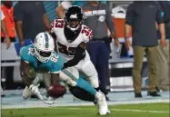  ?? BRYNN ANDERSON - THE ASSOCIATED PRESS ?? Miami Dolphins wide receiver Preston Williams (82) makes a catch in front of Atlanta Falcons cornerback Blidi WrehWilson (33) during the first half of a preseason NFL football game Thursday, Aug. 8, 2019, in Miami Gardens, Fla.