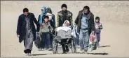  ?? Reuters ?? Iraqi families walk out of western Mosul on Tuesday.