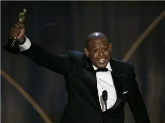  ?? ?? Actor Forest Whitaker accepts the Oscar for best actor Mark J. Terrill/AP2007