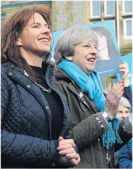  ??  ?? Mrs May celebrates with new MP Trudy Harrison yesterday