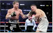  ?? AP/ISAAC BREKKEN ?? Canelo Alvarez lands a punch against Gennady Golovkin in the 12th round during their middleweig­ht title match Saturday in Las Vegas. Alvarez won by majority decision.