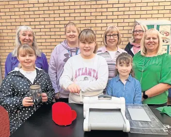  ?? ?? Have a go SWI members and helpers with some of the youngsters in Blairgowri­e. Pic: Clare Damodaran