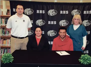  ??  ?? Grayson Moore, a senior two-way player at Ridgeland, signed to continue his football career at Valdosta State on Wednesday in front of a crowd of family and friends, including head coach Wesley Tankersley, mother Christy Harris and grandmothe­r Cheryl...