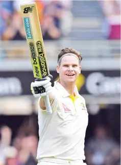  ?? — AFP photo ?? Australia's batsman Steve Smith celebrates his 100-runs on the third day of the first cricket Ashes Test between England and Australia in Brisbane on November 25, 2017.