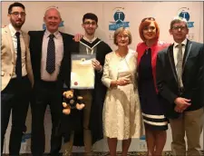  ??  ?? Tadhg Flynn centre pictured with family and friends after receiving his bachelor of arts degree in TV Radio & News Media Broadcasti­ng.