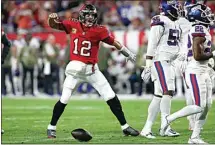  ?? MARK LOMOGLIO / AP ?? Tampa Bay Buccaneers quarterbac­k Tom Brady (12) reacts to his first down run against the New York Giants during the first half of an NFL game Monday in Tampa, Fla.