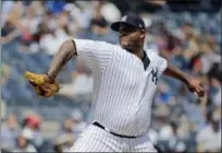  ?? SETH WENIG — THE ASSOCIATED PRESS ?? New York Yankees starting pitcher CC Sabathia throws during the first inning of a baseball game against the Texas Rangers at Yankee Stadium Sunday in New York.