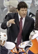  ?? The Associated Press ?? New York Islanders coach Ted Nolan talks with his players during a timeout late in the third period of an NHL hockey game against the Pittsburgh Penguins in Pittsburgh, in 2007.