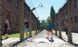  ??  ?? Visitors to the Auschwitz-Birkenau memorial in Oswiecim, Poland, last summer. Photograph: Bartosz Siedlik/AFP/Getty Images