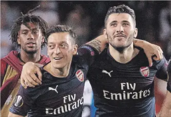  ?? ASSOCIATED PRESS FILE PHOTO ?? From left, Mesut Ozil and Sead Kolasinac are ready to play against Burnley, Arsenal coach Unai Emery said. The duo missed beating Newcastle, 1-0, on Sunday after they were targeted by carjackers in north London.