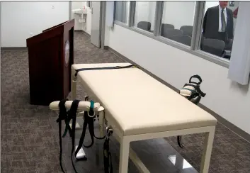  ??  ?? In this 2011 file photo, the execution chamber at the Idaho Maximum Security Institutio­n is shown as Security Institutio­n Warden Randy Blades look on in Boise, Idaho. AP PhoTo/JessIe l. Bonner