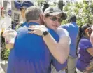  ?? ASHLEE REZIN/SUN-TIMES ?? People at last year’s Highland Park remembranc­e ceremony on July 4, 2023.