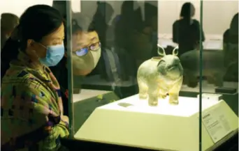  ??  ?? Visitors at an exhibition at the Shanghai Museum on the evening of June 6