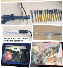  ??  ?? Weapons and cash seized during the operation