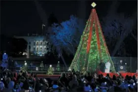  ?? SUSAN WALSH — THE ASSOCIATED PRESS ?? Oh, Christmas tree: President Donald Trump and first lady Melania Trump light the National Christmas Tree on the Ellipse near the White House in Washington Nov. 28. More at www.news-herald.com/nation-world