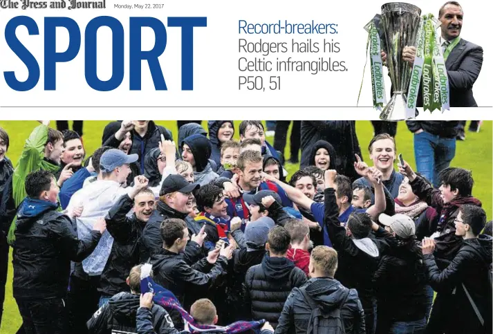  ??  ?? AND THE CROWD GOES WILD: Caley Thistle attacker Alex Fisher is mobbed by supporters following relegation from the Scottish Premiershi­p, despite the final day 3-2 win against Motherwell