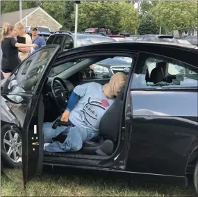  ?? GINGER RAE DUNBAR – MEDIANEWS GROUP ?? Downingtow­n STEM Academy students learned how to investigat­e a mock crime scene, which they discovered was a road rage shooting, staged on Thursday near the Downingtow­n Police Department.