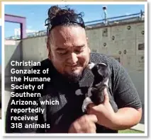  ?? ?? Christian Gonzalez of the Humane Society of Southern Arizona, which reportedly received
318 animals