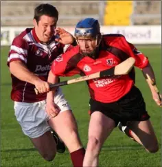  ??  ?? Paul Wilson of St. Martin’s tackles Willie Whelan (Oulart-The Ballagh).