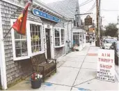  ?? GETTY IMAGES ?? Local thrift shops like this one in Wellfleet, Mass., can carry items with a coastal New England flair and give visitors a feel for the area.