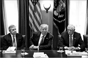  ?? EVAN VUCCI/AP ?? President Donald Trump meets with lawmakers, including Sen. Dick Durbin, D-Ill., left, and Rep. Steny Hoyer, D-Md., about immigratio­n policy Tuesday. Some lawmakers are trying to protect immigrants brought to the country illegally as children.