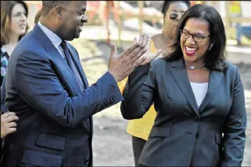  ?? BRANT SANDERLIN / BSANDERLIN@AJC.COM ?? Mayor Kasim Reed has said he hired Atlanta Watershed Commission­er Kishia Powell (right) based upon the recommenda­tion of two mayors and two engineers.