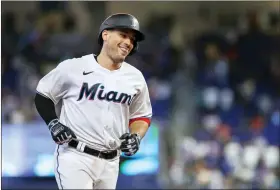  ?? DAVID SANTIAGO — MIAMI HERALD VIA AP ?? Miami Marlins’ Nick Fortes smiles as he rounds the bases after hitting a walkoff solo home run during the ninth inning of a baseball game against the New York Mets, Sunday, June 26, 2022, in Miami.