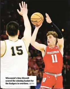  ?? GETTY ?? Wisconsin’s Max Klesmit scored the winning basket for the Badgers in overtime.