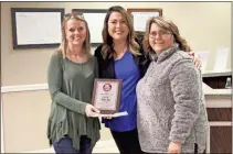  ?? kevin myrick ?? Ashly Ray was named the 2019 Citizen of the Year by Polk County, and was awarded by Great Clips of Rockmart with an additional $100 Amazon gift card. Pictured with Ray are Jamie Bosurgia of Great Clips (center) and Commission Chair Jennifer Hulsey.