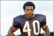  ?? (AP file photo) ?? Gale Sayers, who died Wednesday at 77, was a unanimous choice for NFL rookie of the year in 1965. He set one NFL record with six touchdowns in a game and set another with 22 touchdowns in his first season: 14 rushing, 6 receiving, 1 punt and 1 kickoff return.