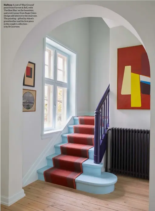  ??  ?? Hallway A coat of ‘Blue Ground’ paint from Farrow & Ball, with ‘Pavilion Blue’ on the bannister, and a red runner from Roger Oates Design add interest to the staircase. The painting – gifted by Adam’s grandmothe­r and the first piece in the couple’s collection – is by Ib Geertsen