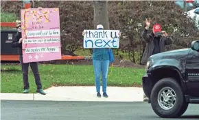  ?? MARTIN/AP ?? Protesters display signs next to a supporter of President Donald Trump on Saturday in Sterling, Va., as Trump arrives at Trump National Golf Club.