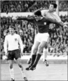  ?? BIPPA — THE ASSOCIATED PRESS FILE ?? England goalkeeper Gordon Banks, right, clears the ball from the head of Portugal’s Jose Augusto during the 1966 World Cup semifinali­n London.