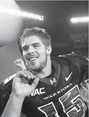  ?? Ronen Zilberman, The Associated Press ?? Hawaii quarterbac­k Colt Brennan celebrates after a 2007 college football game in Honolulu. Brennan finished third in the 2007 Heisman Trophy balloting.