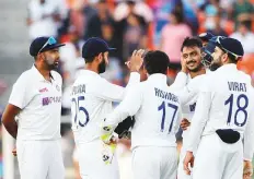  ?? ANI ?? India players celebrate the wicket of England captain Joe Root during the third Test at Narendra Modi Stadium. The spin-friendly pitch has come in for plenty of criticism.