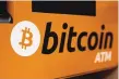  ?? KIN CHEUNG/ASSOCIATED PRESS ?? Bitcoin’s market value has reached $1 trillion for the first time.