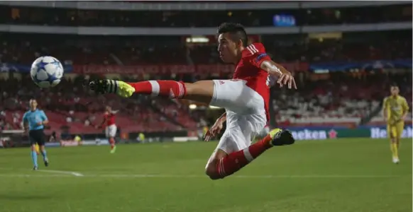  ?? RAFAEL MARCHANTE /REUTERS ?? Benfica’s Nico Gaitan gets horizontal to get a shot off in the Portuguese team’s Champions League Group C match against Kazakhstan’s Astana on Tuesday. Benfica won 2-0.