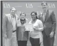  ?? Submitted photo ?? ■ From left, Jim and Lindy Franks present a certificat­e for the Jim and Lindy Franks Endowed Scholarshi­p to Chassity Glenn alongside University of Arkansas Hope-Texarkana Chancellor Chris Thomason.