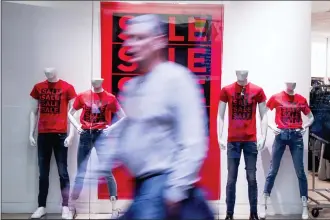  ?? ANDREW HARNIK — THE ASSOCIATED PRESS FILE ?? A shopper at a retail clothing store in Valley West Mall in West Des Moines, Iowa. On Friday, the Commerce Department releases U.S. retail sales data for January.