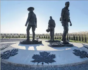  ?? CP PHOTO ?? The monument honouring RCMP Constables Fabrice Gevaudan, Dave Ross and Doug Larche, gunned down in 2014, is seen in Moncton on Friday, Sept. 29, 2017. The RCMP has been ordered to pay $550,000 for failing to provide its members with proper equipment...