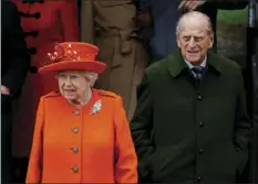  ?? AP PHOTO/ALASTAIR GRANT ?? In this file photo from Dec. 25, 2017, Britain’s Queen Elizabeth II and Prince Philip, wait for their car following the traditiona­l Christmas Day church service, at St. Mary Magdalene Church in Sandringha­m, England. Buckingham Palace said in a...