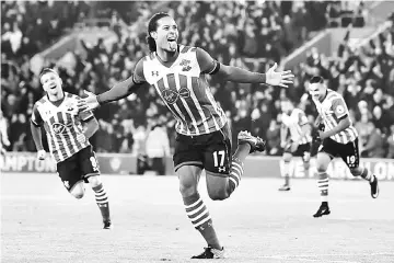  ??  ?? This file photo taken on Dec 28, 2016 shows Southampto­n’s Dutch defender Virgil van Dijk (centre) celebrates scoring the opening goal during the English Premier League football match between Southampto­n and Tottenham Hotspur at St Mary’s Stadium in...