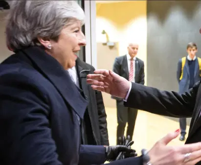  ??  ?? You made it! Theresa May arrives in Brussels just before 6am to a warm hug from EU President Jean-Claude Juncker