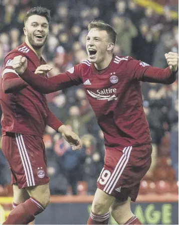  ??  ?? 0 Aberdeen matchwinne­r Lewis Ferguson, right, celebrates his goal with Connor Mclennan.