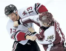  ?? CLIFFORD SKARSTEDT/EXAMINER FILES ?? Peterborou­gh Petes forward Zach Gallant trades punches with Guelph Storm's Quinn Hanna, a Peterborou­gh native, during Ontario Hockey League action Dec. 3 at the Memorial Centre. Fighting in the OHL was down 48 per cent this season.