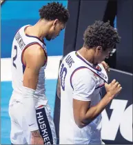  ?? Robert Franklin / Associated Press ?? UConn’s James Bouknight, left, and Brendan Adams head off the court following the team's 63-54 loss to Maryland in a first-round NCAA Tournament game on Saturday at Mackey Arena in West Lafayette, Ind.